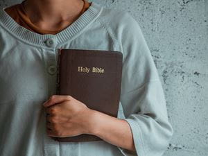 woman holding bible