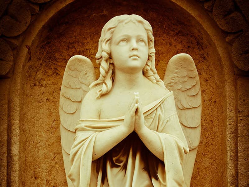 Angel statue praying