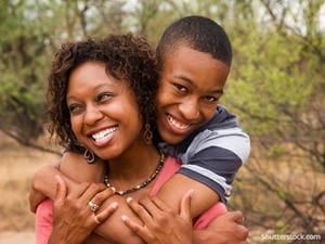 mother teen son hug happy