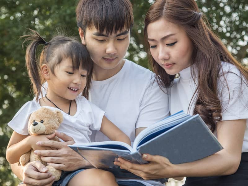 Family reading with child