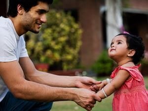 parenting father toddler outside playing