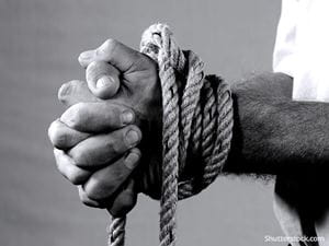 man ropes tied wrists captive victim