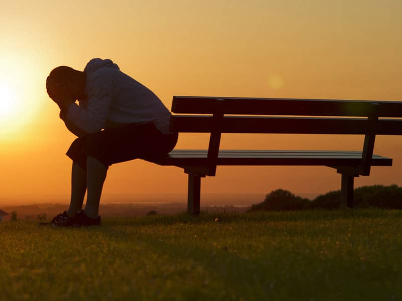 Grieving Man On Bench
