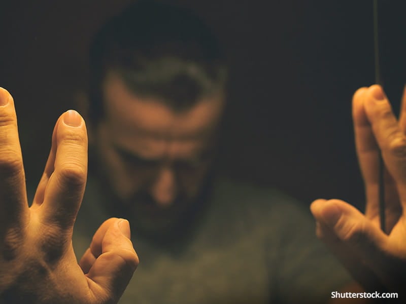 depression-man-reflection-hands