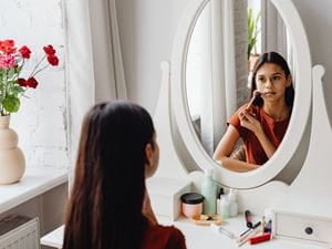 putting on makeup