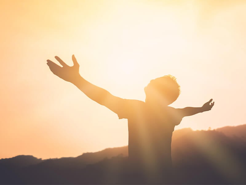 Man lifting his hands up