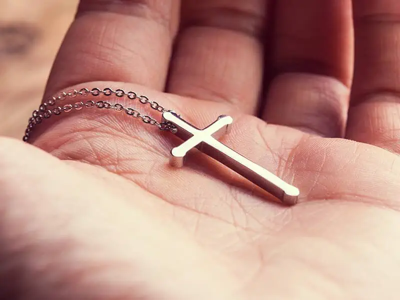 cross in palm of hand