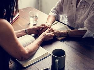 Man and woman praying together