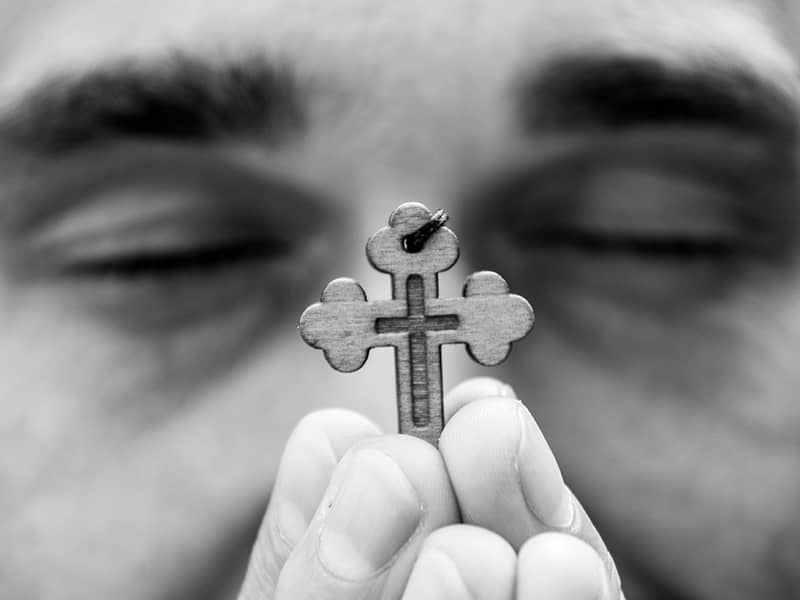 Man holding cross