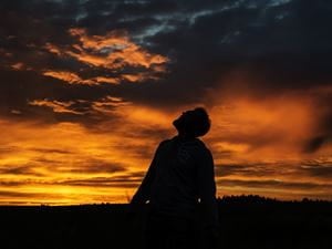 Man looking at sky.