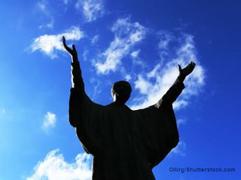 Silloutte of man praising