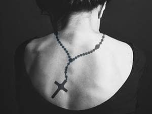 Rosary on Back Tattoo