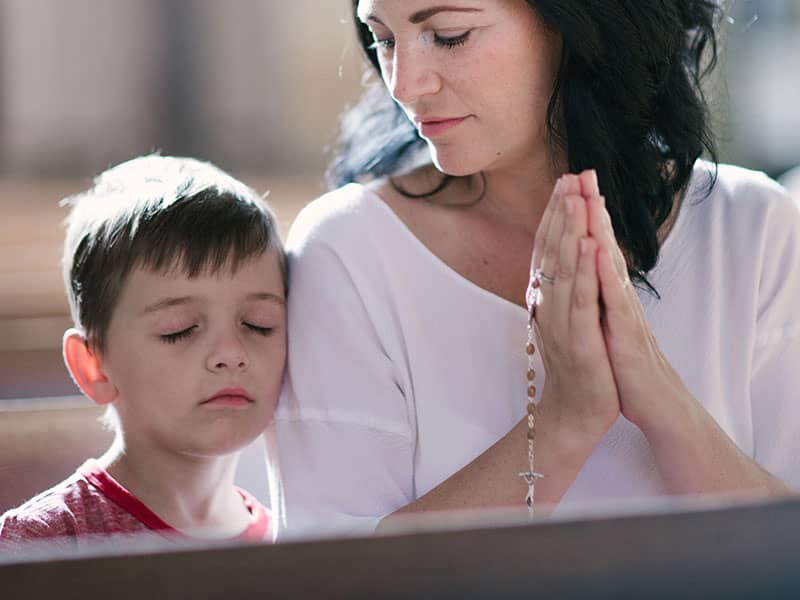 Mom and son in church