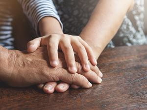 Family holding hands