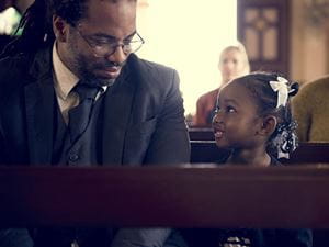 father and daughter at church