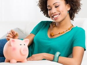 Woman With Piggy Bank