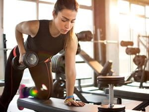 Woman using weights