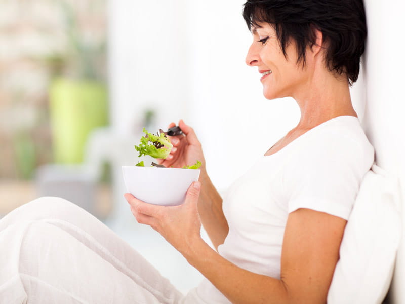 Woman eating salad