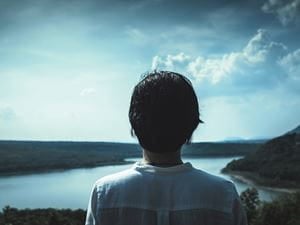 woman looking at lake