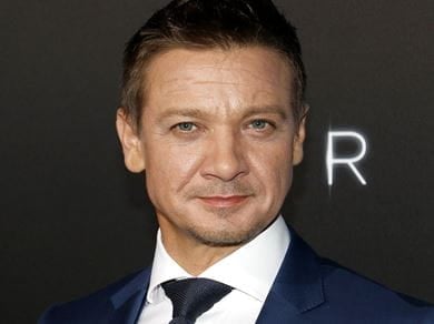 Jeremy Renner in a suit 