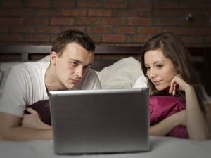 Couple looking at laptop 