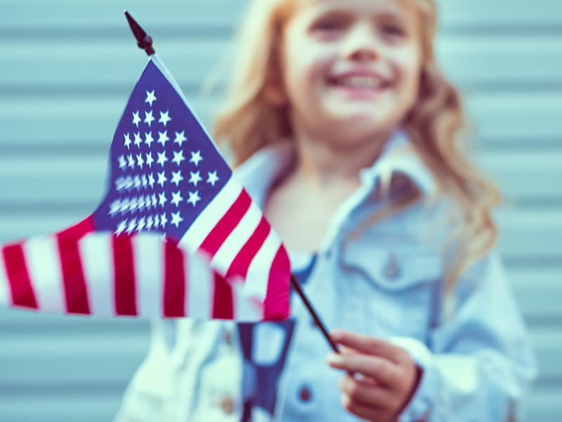 Girl Holding American Flag