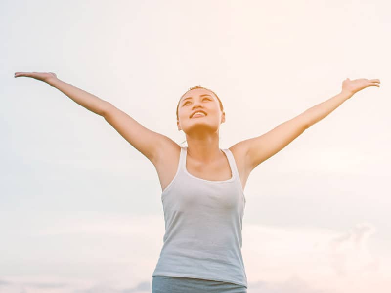 happy woman praising 