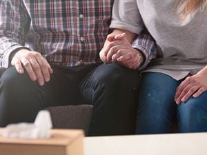 Couple holding hands