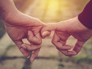 Couple holding hands