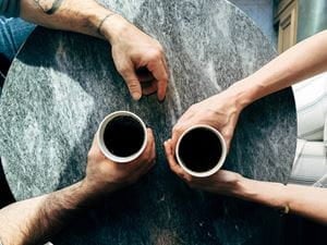 Man and woman on a date with coffee