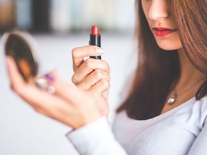 Woman Putting on Makeup