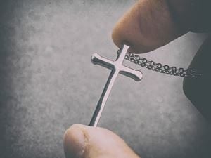 Woman holding cross