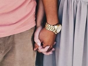 Couple holding hands