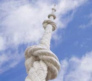 White rope with knots going up into the sky