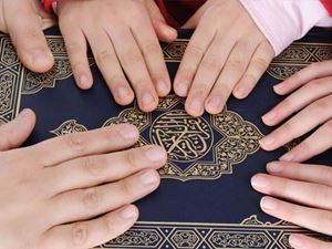 Family Hands on Bible