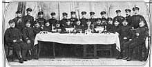 Jewish-Russian soldiers posing at a table.