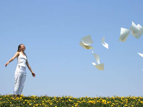 Woman letting go of papers