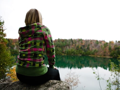 Girl looking at pond