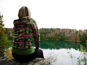 Girl looking at pond