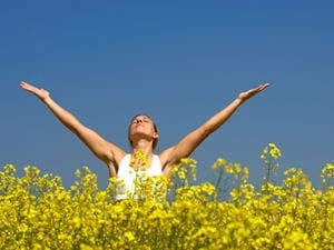 Woman stretching arms into the air