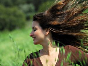 Woman in a breezy meadow
