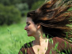 Woman in a breezy meadow