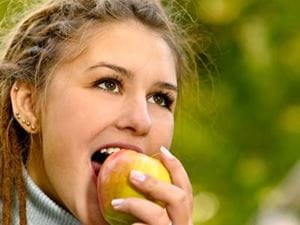 Woman biting apple