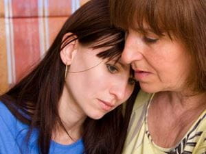 Upset daughter and comforting mother