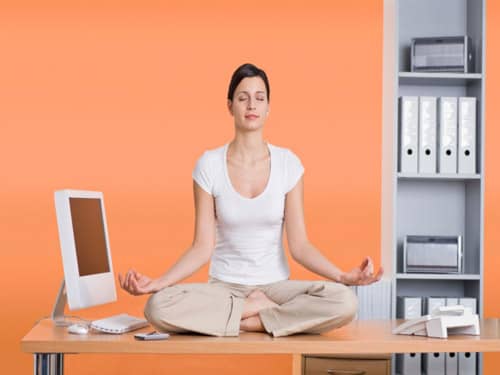 Focused woman meditating