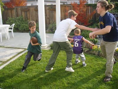 family playing football