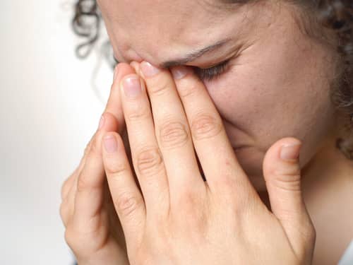 Woman with sinus pain