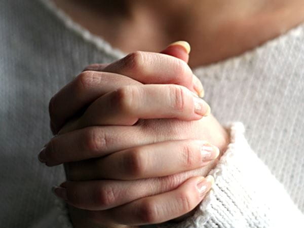 Woman praying hands