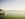 Woman sitting on the end of a pier overlooking lake