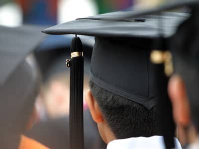 Graduate wearing a graduation cap